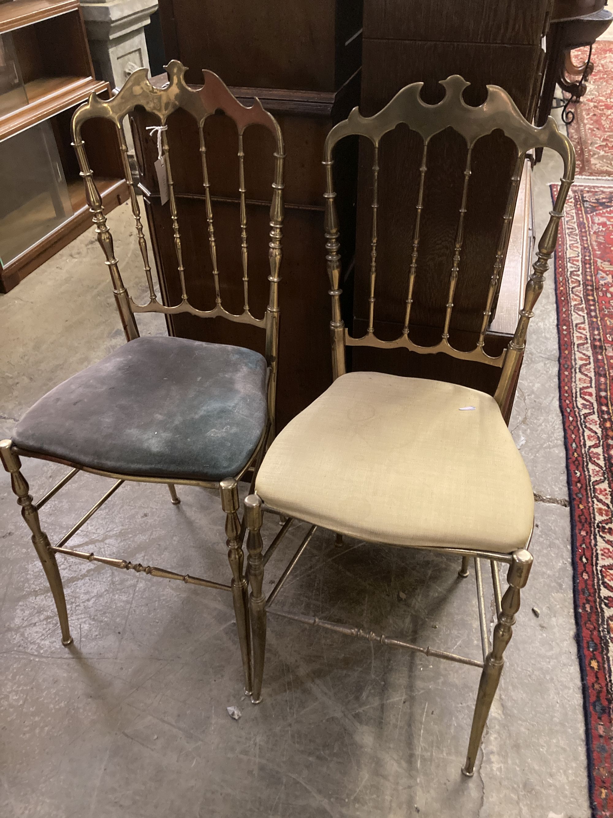 A pair of brass side chairs